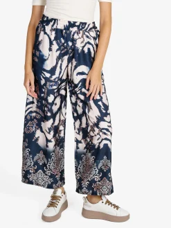 Solada Pantaloni donna effetto raso con stampe - blu scuro